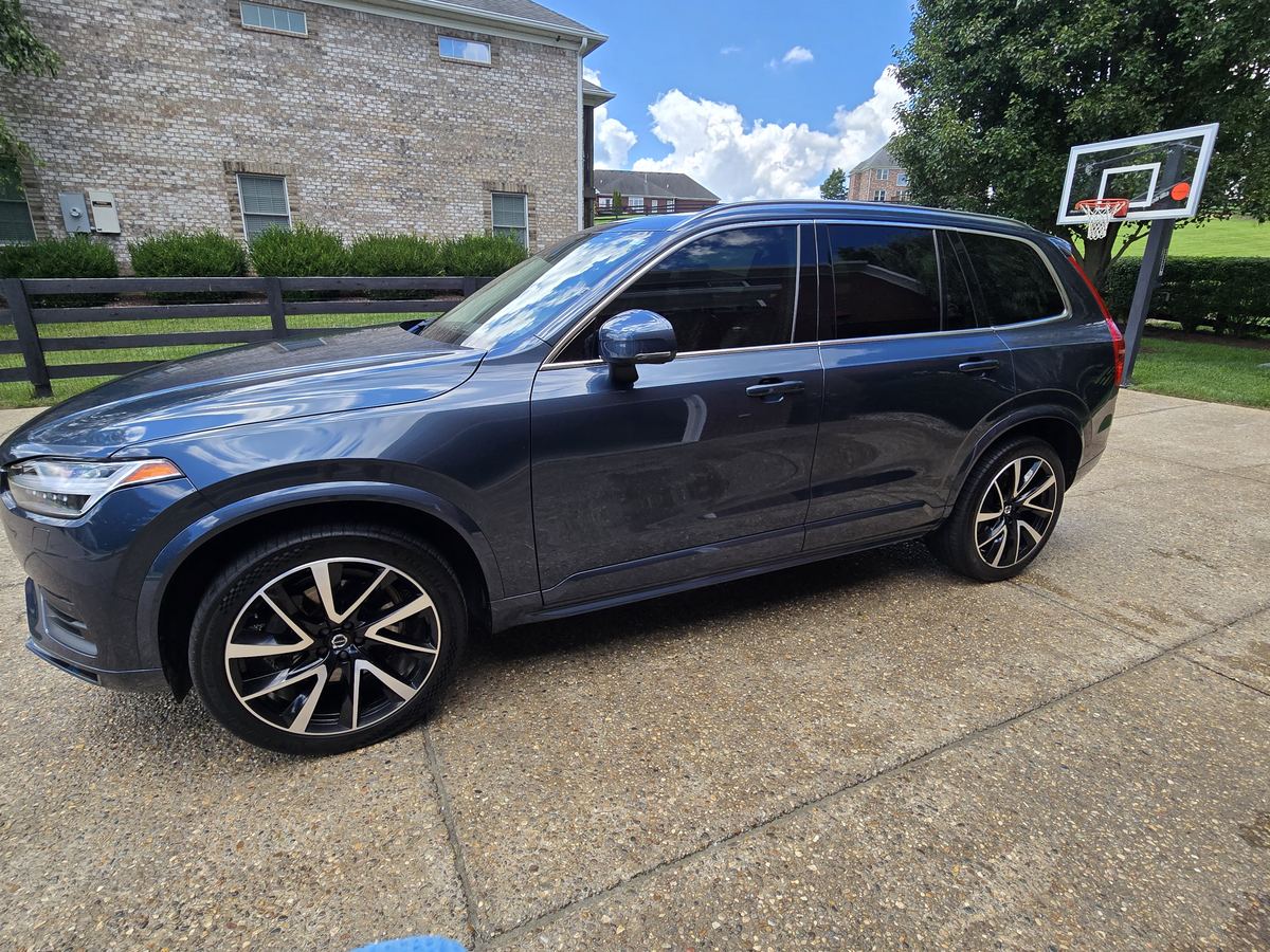 Dark blue Volvo SUV after a maintenance detail